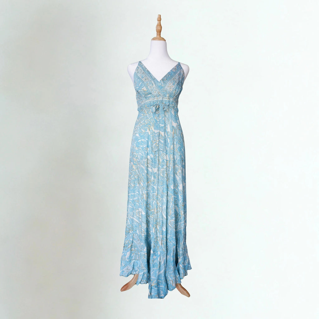 Blue paisley dress with white and gold detail on a mannequin with a white background