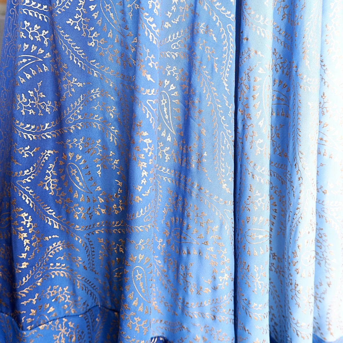 Blue fabric with gold paisley pattern