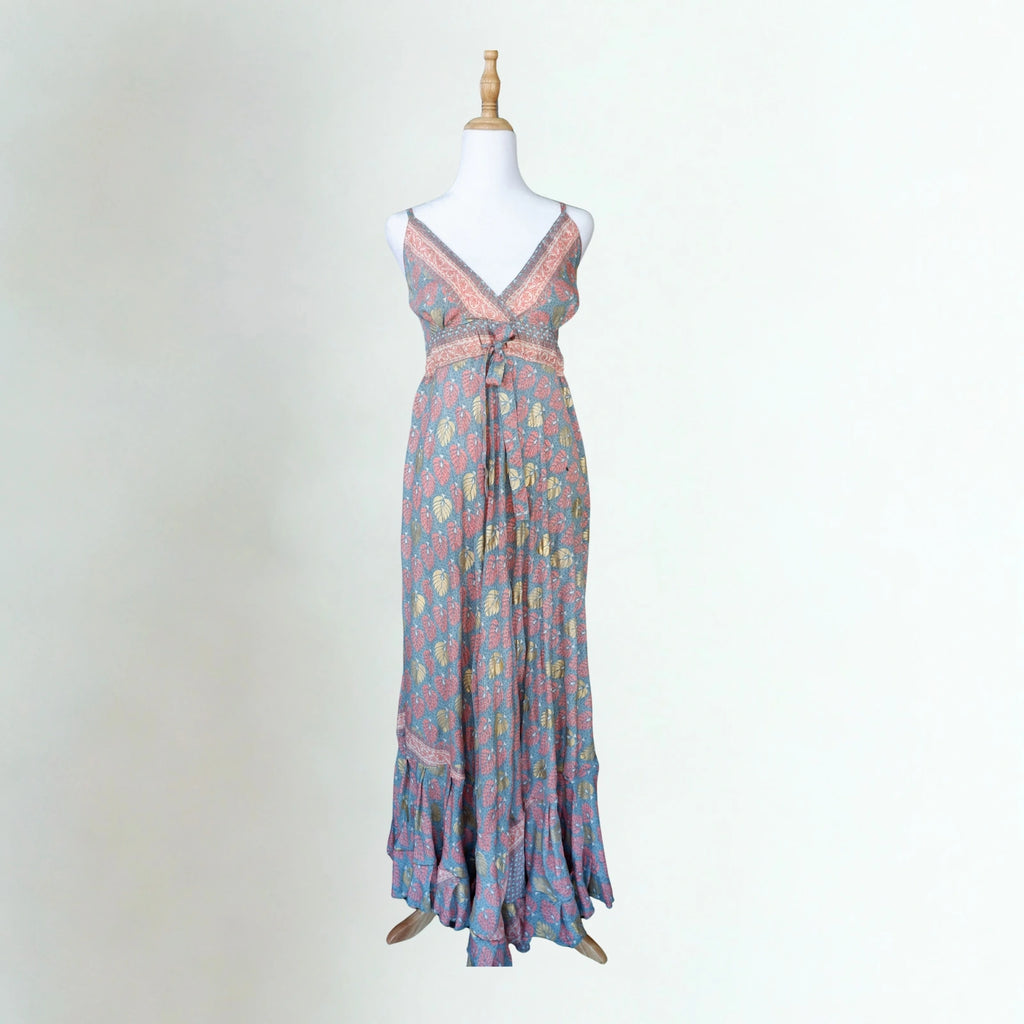 Floral patterned dress on a mannequin against a white background